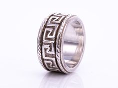 Fabulous vintage sterling silver ring with Greek key design! Excellent vintage condition! Ring size 7.75 Ring width 3/8" Greek Promise Ring, Versace Ring Silver, Greek Silver Jewelry, Greek Rings, Ancient Greek Ring, Greek Ring, Vintage Sterling Silver Rings, Key Design, Greek Key