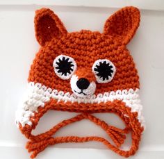 a crocheted hat with eyes and ears