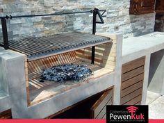 an outdoor grill made out of concrete and steel