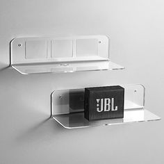 two clear shelves with black and white letters on them, one is labeled jbl