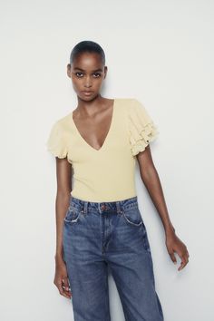 RUFFLED RIB BODYSUIT - Light yellow | ZARA United States Summer Stretch V-neck Short Sleeve Top, Summer V-neck Stretch Short Sleeve Top, V-neck Stretch Short Sleeve Top For Summer, Stretch V-neck Short Sleeve Top For Summer, Spring V-neck Fitted T-shirt, Spring Fitted V-neck T-shirt, Fitted V-neck T-shirt For Spring, Trendy Summer Puff Sleeve Top, Relaxed Fit Short Sleeve Knit Top For Summer