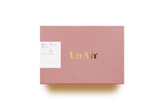 an unwrapped pink box with the word unwrapp on it