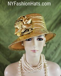 Women's Couture Designer Metallic Gold Lame Fabric Rosette Abstract Slant Small Brim Fashion Hat. The Small Brim Tilts Downward On This Classic Styled Dress Hat. A Lame Band Encircles The Crown Of This Simple Yet Very Elegant Dress Hat.  This Hat Can Also Be Work As A Casual Statement Piece. This Statement Metallic Gold Hat Is Custom Made And Designed By NY Fashion Hats Couture Millinery Headwear Apparel. This Hat Is Suited For Weddings, Brides, Mother Of The Bride, Church, Temple, Funerals, Sab Brides Mother, Fabric Rosette, Gold Hat, Lame Dress, Lame Fabric, Bridal Hat, Gold Hats, Gold Lame, Dress Hat