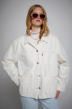 Levi's Iconic Chore Coat It's Ecru Time White It's an icon for a reason. With its timeless chore coat design, a button-down front and classic patch pockets, Levi's Iconic Chore Coat is an easy wardrobe staple.  - A timeless chore coat  - Features classic patch pockets  - With an easy fit and just the right amount of structure White Chore Jacket Outfit, Classic White Cotton Utility Jacket, French Chore Jacket, Chore Coat Womens, 90s White Cotton Outerwear, Chore Coat, Chore Jacket, Karen Walker, Coat Design