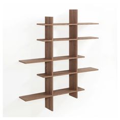 a wooden book shelf with four shelves on each side and one section missing from the wall