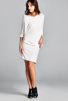 This sophisticated off the shoulder dress is the perfect storm of sexy meets elegant, meets edgy. Why this is in out Top 10 list of wardrobe staples is because its versatility as both a dress and a long top! With 3/4 dolman sleeves and a boatneck, the tunic can be kept as simply dress. Pull it off one shoulder, add some heels and you have a great date dress! Dress has some sheerness and we recommend wearing a nude slip underneath. Only 3 left! Available in off-white. 62% polyester, 33% rayon and Chic Stretch Boat Neck Dress, Chic Boat Neck Mini Dress For Spring, Chic Spring Mini Dress With Boat Neck, Spring Boat Neck Dress For Night Out, Chic Oversized Mini Dress, Oversized Chic Mini Dress For Spring, Chic Fall Mini Dress With 3/4 Sleeves, Elegant Oversized Mini Dress, Summer Boat Neck Dress For Night Out