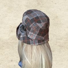 This cloche hat has a wide brim. The brim can be turned up or turned down. It's easy to take shape you want. It is an elegant accessory for many occasions. One size fits most (21 - 22 inches) This hat can be flat packed for suitcases or handbags . Hand wash and lay flat to dry. NOTE Actual color may slightly different depending on your monitor. Winter Brimmed Bonnet, Winter Brimmed Fitted Bonnet, Fitted Brimmed Winter Bonnet, Warm Brimmed Bonnet For Fall, Brown Brimmed Cloche Hat, One Size Fits Most, Brown Brimmed Cloche Hat One Size, Vintage Brimmed Cloche Hat For Winter, Vintage Winter Brimmed Cloche Hat, Winter Vintage Brimmed Cloche Hat