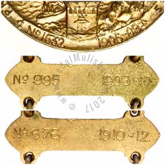 two brass medals with numbers on them