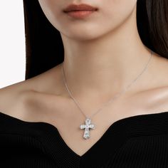 A contemporary interpretation of a classic motif, this Cross pendant in 18 carat white gold is beautifully crafted to showcase the sleek beauty of baguette cut diamonds. Custom cut to fit the design, the diamonds are individually handset by our master artisans to taper in size as they radiate outwards. An elegant Classic Graff cross motif baguette cut diamond pendant with a total weight of approximately 3.06 carats. White Cubic Zirconia Diamond Necklace With Baguette Diamonds, Elegant Silver Diamond Necklace With Rectangular Pendant, Rectangular Pendant With Baguette Diamonds, Luxury Silver Baguette-cut Diamond Necklace, Luxury Silver Baguette Cut Diamond Necklace, White Baguette Diamond Pendant Jewelry, Radiant Cut White Gold Jewelry With Baguette Diamonds, White Gold Moissanite Jewelry With Baguette Diamonds, Crystal Necklace With Baguette Diamonds As Gift