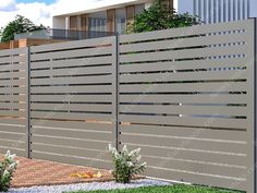 a modern fence in front of a house with grass and bushes on the side walk