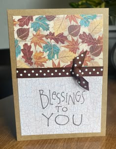 a card with the words blessing to you written in black ink on it and brown ribbon