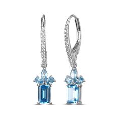 Give her a reason to dress up with these dazzling drop earrings. Crafted in sterling silver Each earring dangle features an emerald-cut Swiss blue topaz Above, a pair of pear-shaped and a marquise-cut London blue topaz create a flourish Round-cut white lab-created sapphires line the linear ear wires The earrings secure with lever backs Blue Topaz Dangle Earrings Fine Jewelry, Fine Jewelry Blue Topaz Drop Earrings, Blue Topaz Drop Earrings Fine Jewelry, Elegant Blue Topaz Earrings With Ear Wire, Formal Blue Topaz Drop Earrings, Blue Topaz Drop Earrings With Matching Set, Sapphire Drop Earrings, Earring Dangle, White Lab