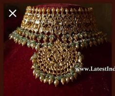 This opulent choker set is fit for a bride and even her close ones attending the wedding. This choker is a perfect amalgam of timeless style and drama that draws in attention. Necklace Closure - Adjustable Dori Earrings Closure - Push Back Style Tip - When it comes to getting a classic look, nothing can be better than kundan. This necklace set is fit for a woman who is fiercely independent yet rooted in traditional and cultural heritage, carving her own style with classic and timeless fashion ch Intricate Design Choker For Reception And Festivals, Intricate Design Choker For Receptions And Festivals, Bollywood Heavy Choker For Wedding, Heavy Choker For Wedding And Diwali, Traditional Chandbali Choker For Wedding, Traditional Chandbali Wedding Choker, Hand Set Chandbali Choker For Wedding, Traditional Tilla Choker For Wedding, Wedding And Festivals Tilla Choker