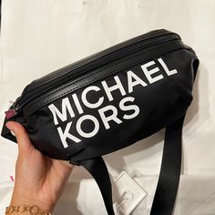 Brand New Michael Kors Black Signature White Mk Logo Belt Bag 100% Authentic Black Shoulder Bag With Letter Print For Errands, Casual Black Bags With Logo, Black Shoulder Bag With Logo For Errands, Trendy Black Shoulder Bag With Logo, Trendy Black Michael Kors Shoulder Bag, Black Letter Print Crossbody Shoulder Bag, Black Crossbody Shoulder Bag With Letter Print, Black Logo Bag For On-the-go, Black On-the-go Bag With Logo