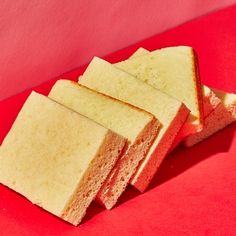 slices of cake sitting on top of a red surface