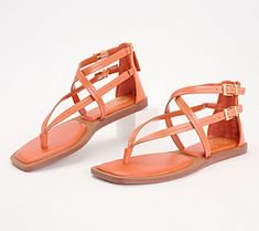 These strappy sandals are sure to show off your fashionista side. From Vince Camuto. Trendy Sandals With Adjustable Heel Strap, Spring Flat Strap Sandals, Spring Flat Sandals With Strap, Trendy Adjustable Sandals With Heel Strap, Spring Flat T-strap Sandals With Buckle Closure, Spring Buckle Closure Flat T-strap Sandals, Trendy T-strap Sandals With Adjustable Strap, Trendy Strap Sandals For Vacation, Trendy Strapped Sandals For Vacation