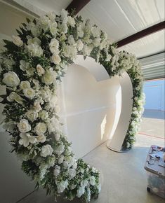 white flowers are arranged in the shape of a heart