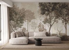 a living room with a couch and wall mural