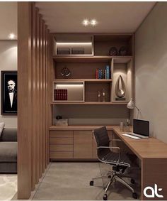 a room with a couch, desk and bookshelf next to a wall mounted bookcase