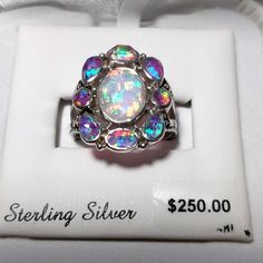 Sterling Silver Rainbow Opal Ring Size 8 This Opal Ring Is Exquisite! It Has All The Colors Of The Rainbow. As You Twist And Turn The Ring And Light Hits It-There Are Many Different Dimensions, Shapes And Designs That Appear. Be The "Talk" Of The Town Or At A Party Or Wherever You Go With This Ring. You Will Really Stand Out Like The Gem You Are With This Ring On Your Finger! Ring Has Only Been Tried On And Is In Original Packaging With Price Tag. No Guarantees Or Warranties Are Being Provided O 4 Stone Opal Ring, Fire Opal Engagement Ring Opal Auctions, Peacock Blue Opal Ring, Purple Opal Wedding Ring, Opal And Saphire Ring, Australian Opal Ring Opal Auctions, Opal Jewelry Opal Auctions, Opal And Amythest Ring, Victorian Opal Cluster Ring