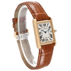 Cartier Tank Louis Yellow Gold Brown Leather Strap Mens Watch W1529756 Card. Quartz movement. 18k yellow gold case 25.0 x 33.0 mm. Circular grained crown set with a blue sapphire cabochon. . Scratch-resistant mineral crystal. Silvered opaline dial with black Roman numeral hour markers and an inner minute track. Sword-shaped blue hands. Date calendar at 3 o'clock aperture. Secret Cartier signature at VII. Brown leather strap with 18K yellow gold tang buckle. Gold Cartier Analog Watch, Classic Yellow Gold Watch Bands With Round Dial, Cartier Analog Watch In Yellow Gold, Cartier Yellow Gold Analog Watch, Classic Yellow Gold Watch Accessories With Subdials, Anniversary Yellow Gold Watch Accessories With Diamond Hour Markers, Classic Cartier Watch Band For Formal Occasions, Classic Yellow Gold Watch Bands With Rectangular Dial, Classic Yellow Gold Watch For Gift