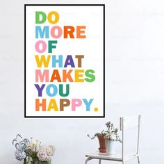 a poster with the words do more of what makes you happy hanging on a wall