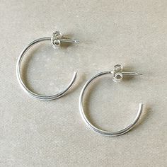 Simple and classic. Lightweight, dainty hoops to wear anywhere and everywhere. Simple Small Hoop Everyday Jewelry, Simple Everyday Hoop Huggie Earrings, Modern Nickel-free Hoop Earrings For Everyday, Classic Small Hoop Jewelry For Everyday, Simple Hoop Huggie Earrings For Everyday, Everyday Modern Nickel-free Hoop Earrings, Classic Hoop Earrings With Simple Design, Classic Hoop Huggie Earrings For Everyday, Classic Circle Earrings For Everyday