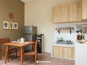 the kitchen is clean and ready to be used for cooking or dining room furniture, as well as other appliances