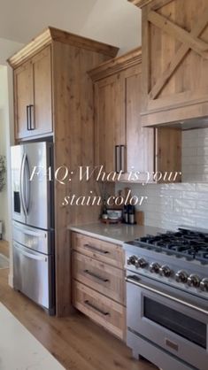 a kitchen with wooden cabinets and stainless steel appliances