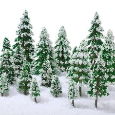 several small trees covered in snow on a white surface