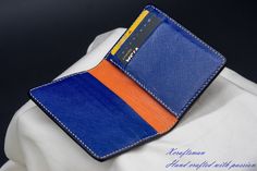 This wallet is unique, you will never see the exact same thing. The exterior alligator leather is cut along its scale's edge to show an orange layer below. The orange line is unique because the texture of the alligator is unique. The wallet opens vibrantly with blue and orange color inside. I've tried my best to put my unique technique and my passion into this small piece. Every single wallet is made to order, there won't be a second same thing. If you are looking for a small accessory but it's Blue Leather Card Holder For Formal Use, Luxury Blue Leather Card Holder, Blue Business Card Holder With Interior Slots, Business Blue Card Holder With Interior Slots, Blue Leather Business Card Holder, Blue Leather Card Holder With Interior Slots, Elegant Blue Bifold Card Holder, Blue Bifold Card Holder For Formal Occasions, Blue Rectangular Card Holder For Formal Occasions