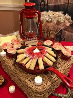 a table topped with lots of food and candles