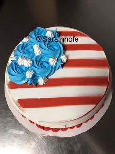 an american flag cake with red, white and blue frosting on it's side