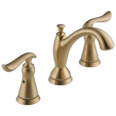 two handle bathroom faucet in brushed brass finish with matching handles and side spray