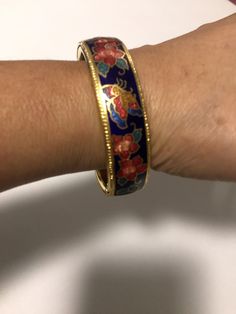 "Vintage enamel bangle with gorgeous butterfly and flowers design. Measurements are 2 1/2\" x 2 1/4\"" Butterfly And Flowers, Filigree Necklaces, Wood Bead Necklace, Enamel Bangle, Enamel Bracelet, Flowers Design, Oct 11, Gold Tone Necklace, Jewelry For Her