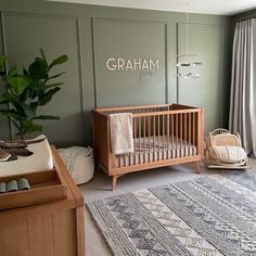 a baby's room with a crib, rugs and other items in it