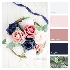 an arrangement of flowers in a basket with blue ribbon and color swatches on white wood