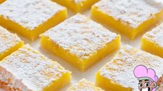 there are many pieces of cake that have been cut into squares with powdered sugar on top