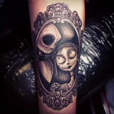 a person with a skull on their arm