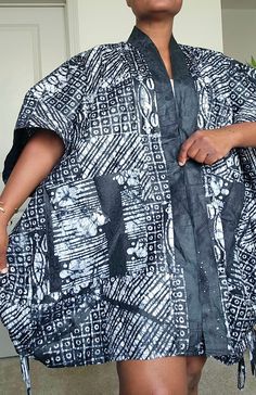 Dear to wear something different, with this beautiful stylish oversized African Tie Dye kimono jacket. Made with soft and comfortable %100 cotton fabric, this knee-length jacket features a stylish black and white color with African pattern design, large  front pockets, this is perfect for any occasion, whether it's party, casual, workwear, or business. The 3/4 kaftan sleeves with front opening  add a unique touch to the jacket, making it supper convenient to put on. This stunning African tye dye kimono jacket can be worn and paired in so many different ways. it's a beautiful silhouette that complements any size and shape.  Crafted by hand with love and care, this jacket is a must-have for any fashion-conscious woman. Its collared design, along with the all-seasons features, make it an idea White Cotton Outerwear With Kimono Sleeves, Oversized Cotton Kaftan, White Oversized Cotton Kaftan, Cotton Long Sleeve Kaftan For Fall, Oversized Cotton Kimono With Kimono Sleeves, Oversized Cotton Outerwear With Kimono Sleeves, Casual Cotton Kaftan With Kimono Sleeves, Black Oversized Cotton Kimono, Black Cotton Outerwear With Kimono-style Sleeves