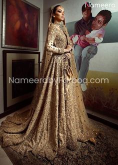 Pakistani Golden Bridal Dress In Gown Style is Heavily Embellished Bridal Gown encrusted with Swarovski stones, resham embroidery and kora dhaka along with a heavily embellished Dupatta. Also this is handwoven silk Gown with 16 organza panels. This Enthralling front-open Gown boasts and elaborate hand printing and glistening crystal work at its borders with net sleeves. This Golden Bridal Gown comes with a small beautiful purse and capri for Gown. Gown: Pakistani Golden Bridal Dress is in Gown S Hsy Bridal, Wedding Anarkali Dress, Wedding Anarkali, Bridal Anarkali, Usa Wedding, Dress Pakistani, Desi Wedding Dresses, Wedding Dress Outfit, Bridal Tops