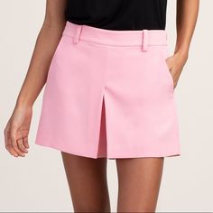 New With Tags Trina Turk Solar Short Pink An Overall Clean And Sleek Look. The High-Rise Short Features A Relaxed Hip And Thigh And Has A Slightly Flared Silhouette To This Modern Skort, A Shorts And Skirt Combo. Wear As A Weekend-Casual Look, Paired With A Tee, Or Dress It Up With A Silk Blouse And Heels For A Night Out. Belt Loop Waistband Concealed Side Zip Closure Inverted Front Pleat Side Slash Pockets Inseam: 4", Front Rise: 11.38" True To Size 100% Polyester Made In: United States Light Pink Shorts, Green Chinos, Cream Shorts, Tailored Shorts, Mid Rise Shorts, Summer Stripes, Twill Shirt, Plaid Shorts, High Rise Shorts