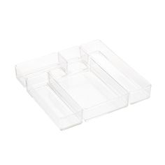 three clear plastic drawers with dividers on each side and one open drawer in the middle