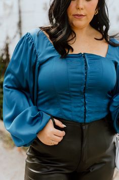 Teal crop top Corset hook enclosures along front Long sleeve w/ stretching cuff Smocked back 95% Poly + 5% Spandex Non-sheer Semi-stretching Fit: True to size. SIZE CHART (Measured in inches) Size Fits Like Length Bust 1XL 12/14 20 40 2XL 16 20.5 42 3XL 18/20 21 46 Model Specs Kennedy is wearing a 1XL. Height: 5'8 Size: 14 Fitted Crop Top For Brunch In Fall, Fitted Crop Top For Fall Brunch, Stretch Crop Top For Brunch In Fall, Teal Corset, Teal Crop Top, Top Corset, Us Postal Service, Corset Crop Top, Cropped Top