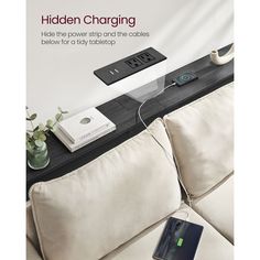 an advertisement for the hidden charging device is displayed on a table next to a couch