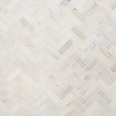 a white marble herringle tile pattern