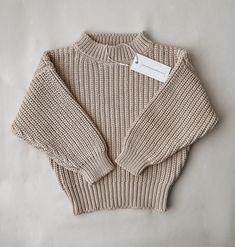 Our oversized chunky knit sweater was designed for your most cozy fall and winter! Made with 100% organic cotton, because your child deserves only the best! Everyday Chunky Knit Sweater, Oversized Waffle Knit Sweater For Everyday, Chunky Knit Neutral Sweater, Cozy Brown Waffle Knit Sweater, Cozy Long Sleeve Oatmeal Sweater, Beige Waffle Knit Sweater For Winter, Cozy Chunky Long Sleeve Sweater, Cozy Oatmeal Sweater For Fall, Chunk Sweater