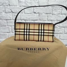 Burberry Nova Check Shoulder Bag That Has A Coated Canvas Leather, With A Zip Closure And An Interior Zip Pocket And Silver Tone Hardware. Includes Dust Bag. Size: Small ( See Measurements ) Color: Beige, Black, Burgundy Condition: New Without Tags, Does Include Dust Bag Approximate Measurements In Photos Smoke And Pet Free Home Burberry Two Tone Bag, Burberry The Beat, Burberry Purse, Burberry Shoulder Bag, White Shoulder Bag, Burberry Vintage, Vintage Shoulder Bag, Vintage Burberry, Leather Hobo Bag