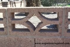 a stone wall with an ornamental design on it