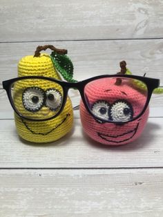 two crocheted glasses sitting next to each other